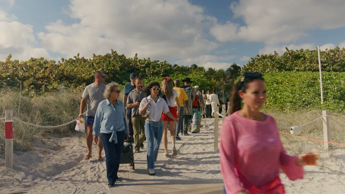 Visitors on the beach at a past SCOPE Art Show edition